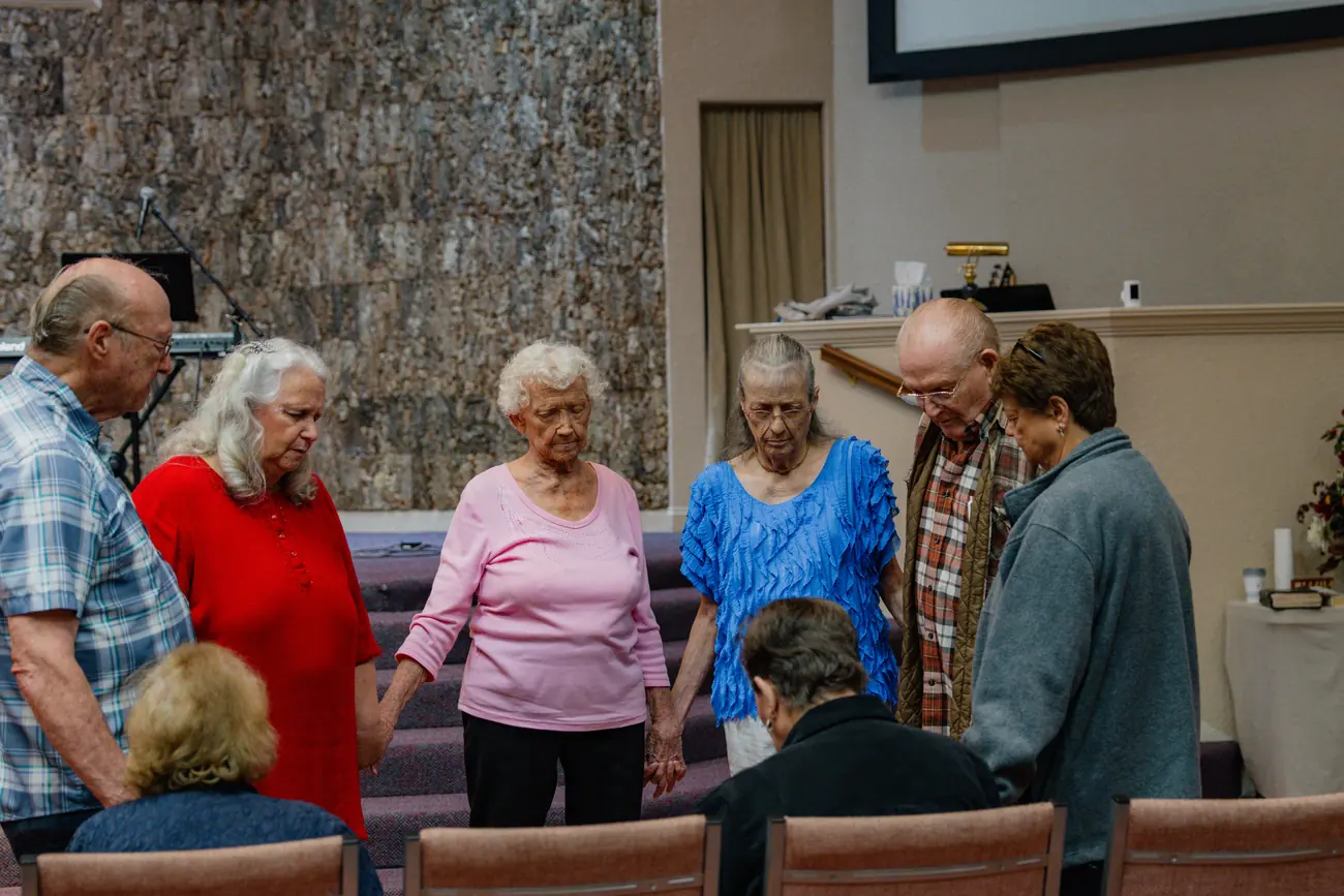 Hands joined in a circle of prayer