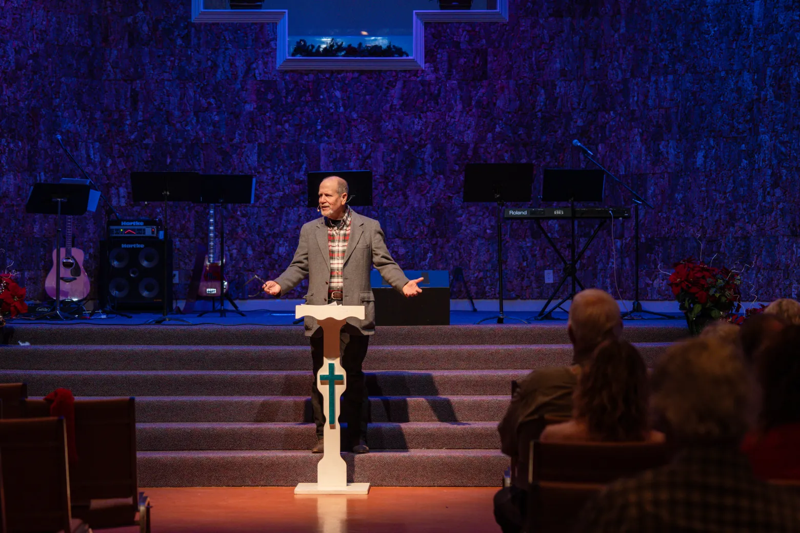 Pastor Joe Taylor preaching with open arms